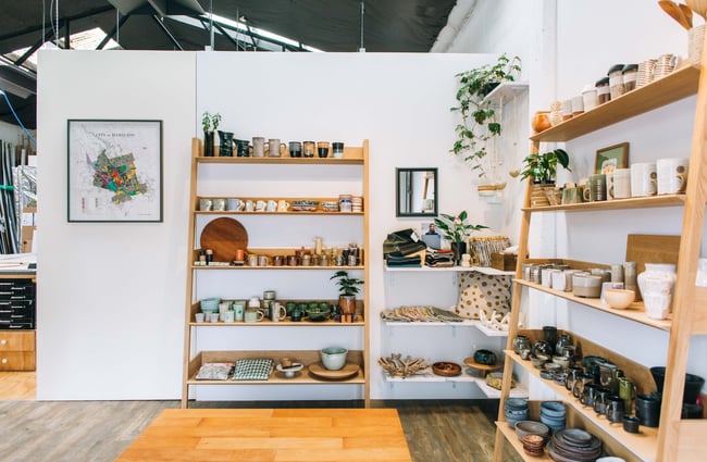 The shop interior featuring lots of different types of ceramics on display.