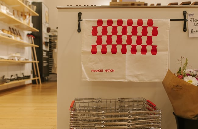 Tea towel and shopping baskets at Frances Nation Home.