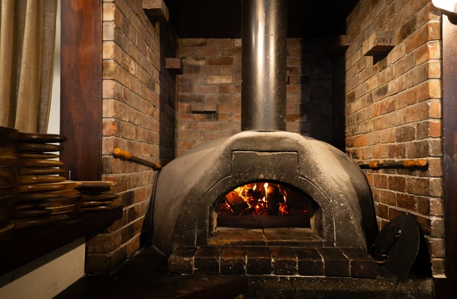 A close up of a fire inside a fireplace.