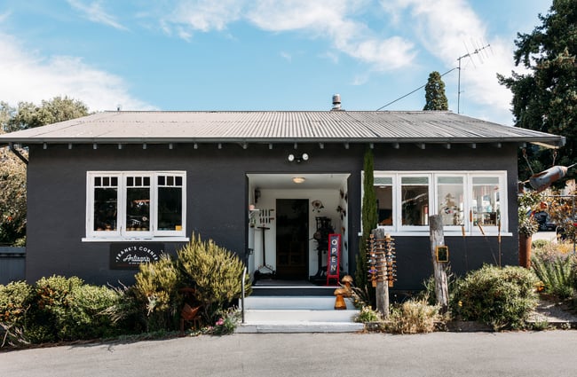 A grey bungalow on a sunny day.