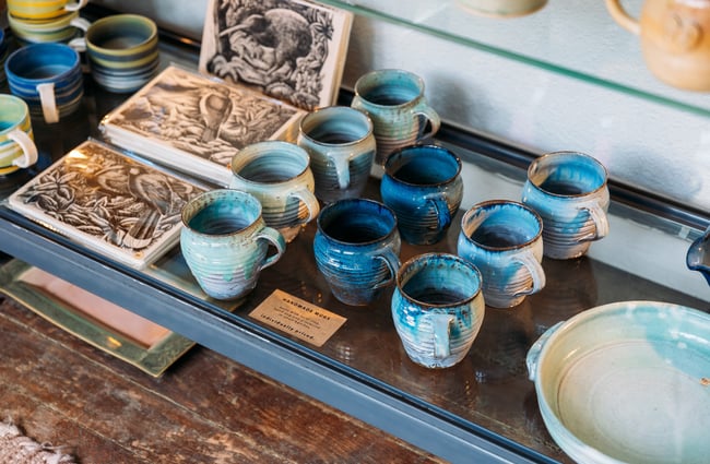 A close up of blue ceramic cups.