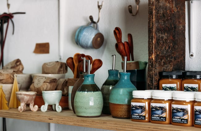 A close up of ceramic vases and cups on display.