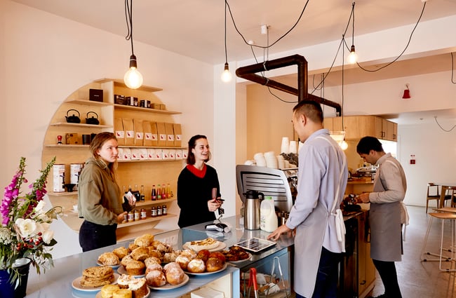 A customer ordering at the counter inside Frank's Newtown cafe in Newtown Wellington.