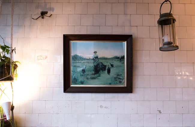 Framed artwork on wall.