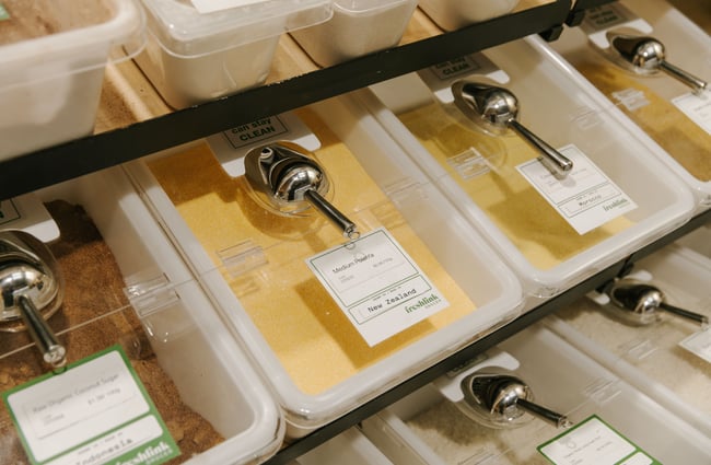 Self serving tubs filled with different flours and sugars.