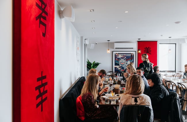 Diners eating at tables.