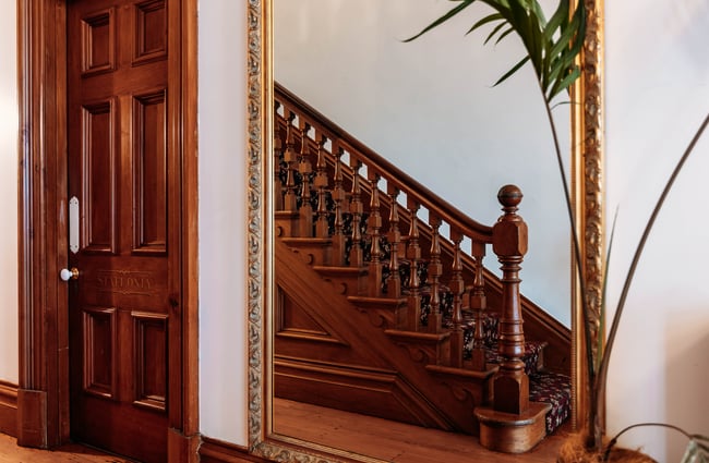 Beautifully restored wooden staircase at Gear Homestead.