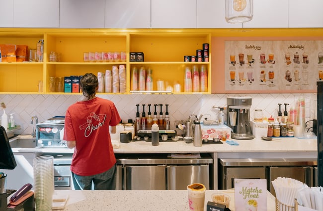 Staff member working behind counter of Gelato & Tea in Christchurch