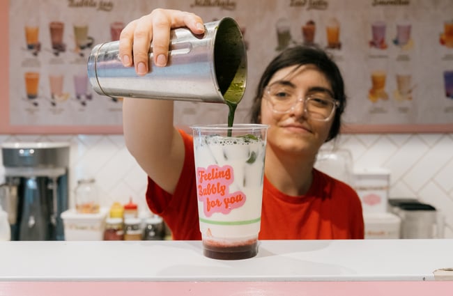 Worker pouring bubble tea on counter at Gelato & Tea in Christchurch