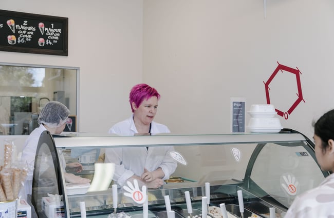 Woman helping customer choose gelato at Gelato Lab in Christchurch.
