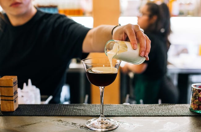 A person making a cocktail at Gemmayze Street.