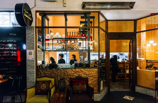 Looking through window into the kitchen and bar area at Gemmayze Street.