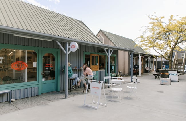 The exterior of the General Service workspace building a cafe window.