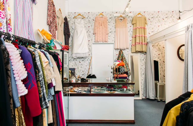 The counter and clothing on racks inside Georgie Girl.