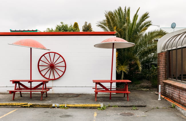 Red outdoor seating on a grey day.