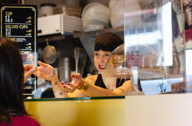 A woman serving.