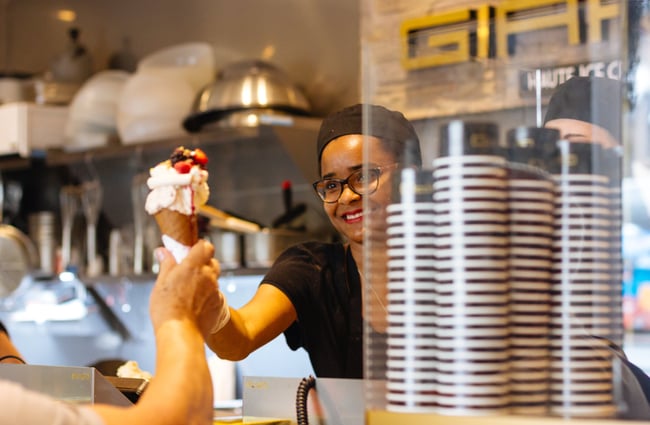 A woman serving a gelato.