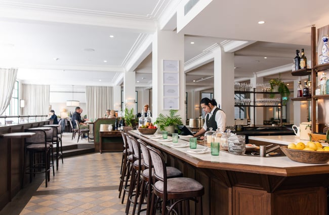 Bar area and dining room at Gilt Brasserie in Auckland