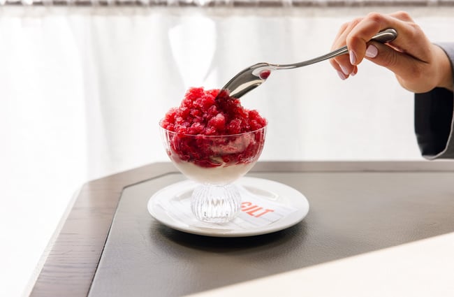 Spoon digging into granita at Gilt Brasserie in Auckland