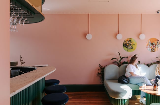 Pastel coloured walls and seating area at gin gin in Christchurch.