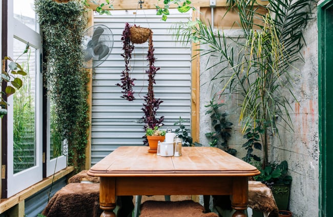 An outdoor dining table and chairs at Gispy Kitchen cafe Wellington.