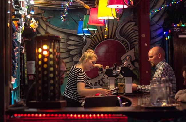 A woman serving drinks.