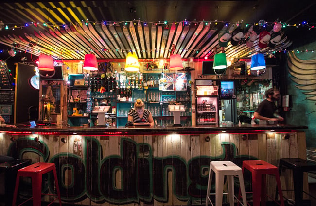 A woman behind the bar.