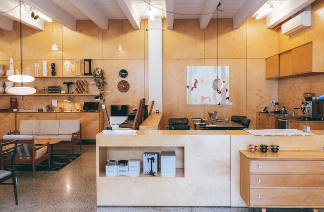 An interior image of the store with open wood walls.