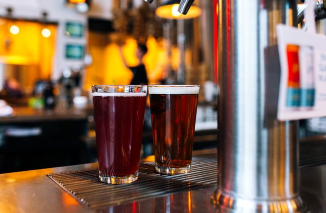 Beer and a cider on the bar at Good George Dining Hall, Hamilton.