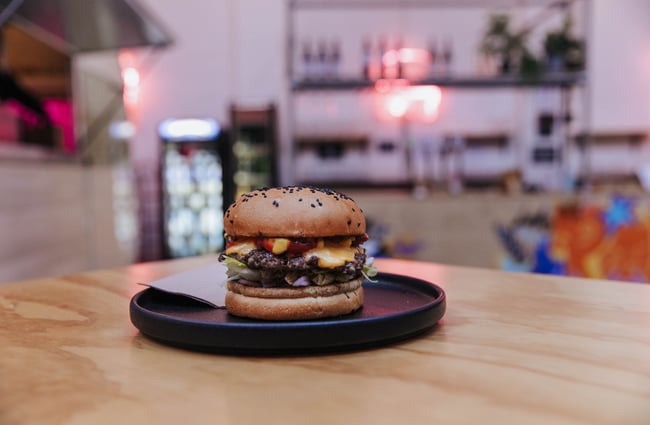 A burger on a table.