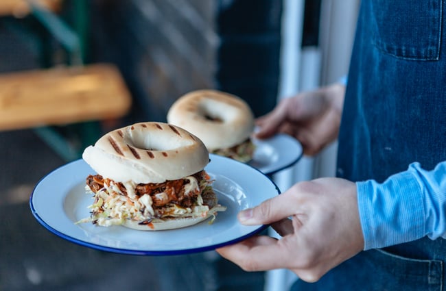 A man carrying bagels.