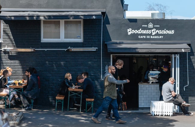 People walking past the cafe.