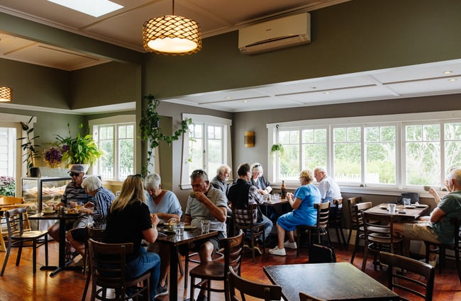 Dining room full of patrons at Goose Bakery.
