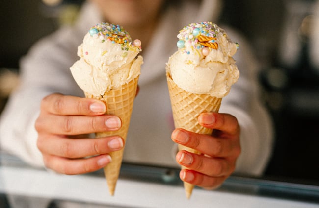 Two ice creams being handed to customers at Gorge Quarter.