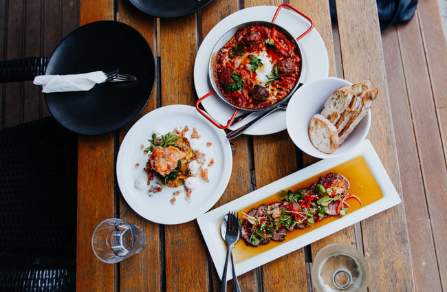 A table of food at Ōtoromiro Hotel, Governors Bay.