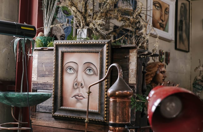 Close up of a painting of a face at Grainstone Gallery in Ōamaru.