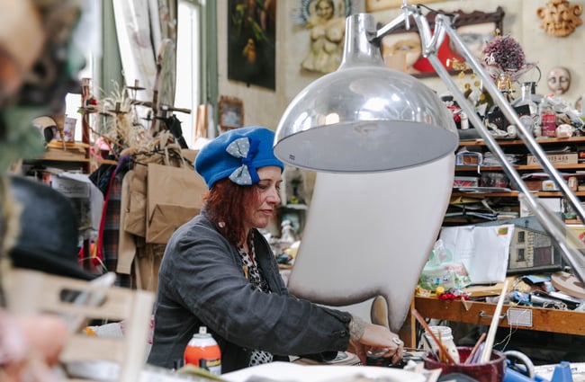 Donna Demente working on her artwork at Grainstone Gallery in Ōamaru.