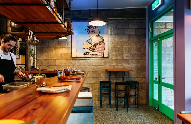 A chef working behind the bar at Graze.