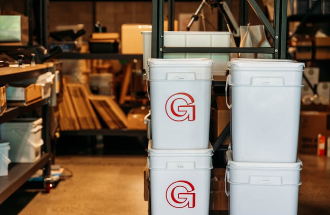White buckets stacked on top of each other.