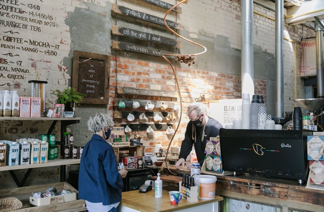 Customer ordering a coffee at Grid Coffee, Dunedin.