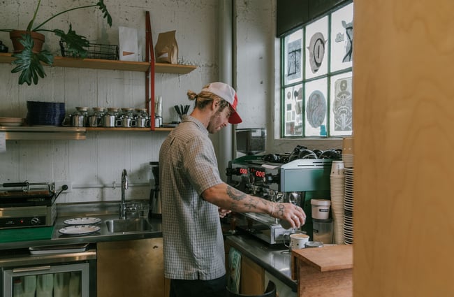 Barista making coffee at Grizzly Baked Goods in the Christchurch CBD.