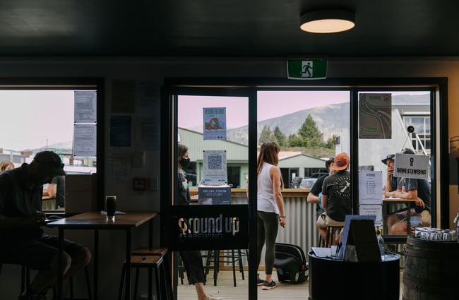 Looking out of the door to the balcony area at Ground Up Brewing, Wānaka.