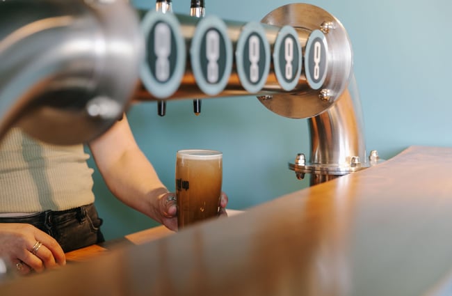 Pint of stout settling at Ground Up Brewing, Wānaka.
