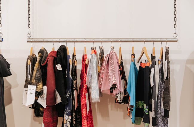 Close up of clothes on a rack.
