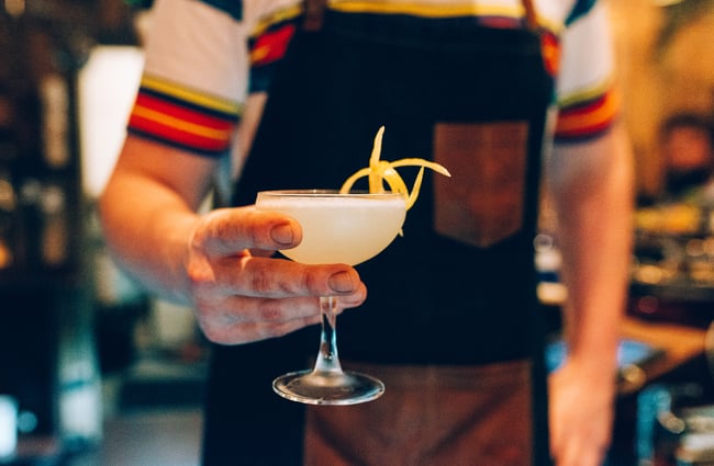 A man holding a cocktail.