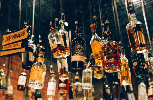 Hanging bottles from roof.