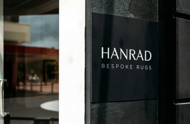 The black and white Hanrad sign on a wall.