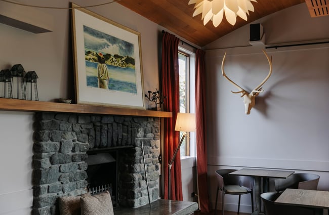 Stone fireplace at Hapuku Lodge.