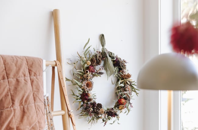 Dried flower wreath hanging on wall at Harakeke Florist in Christchurch.