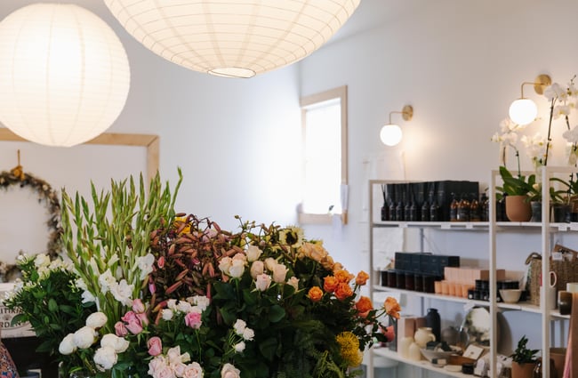 Flowers under big paper lanterns at Harakeke Florist in Christchurch.